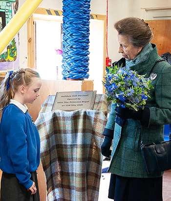 Princess Anne receiving a bouquet at Aultbea 2026